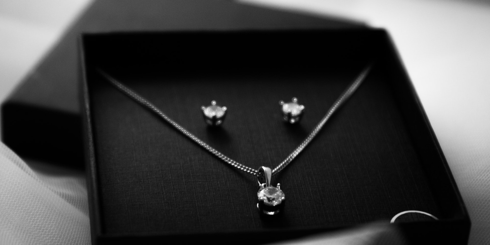 Customized paper jewelry box with hollowed out windows for marketing purposes, produced by Crown Win