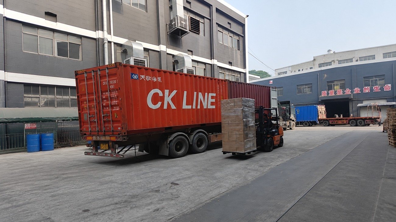 Crown Win Box Manufacturer factory warehouse loading shipping container with bulk holiday paper packaging boxes, showing large production & shipping capacity for seasonal orders
